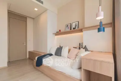Modern bedroom with stylish decor and cozy ambiance in a contemporary apartment.
