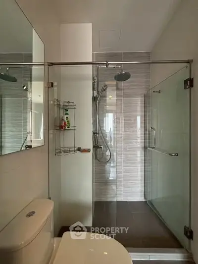 Modern bathroom with glass shower and sleek fixtures