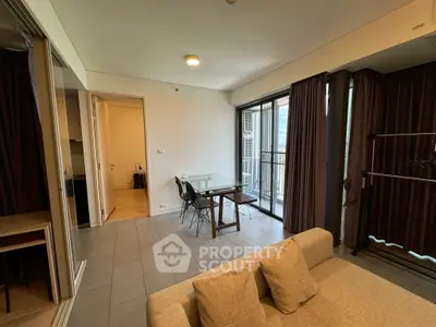 Modern living room with balcony access and stylish furniture