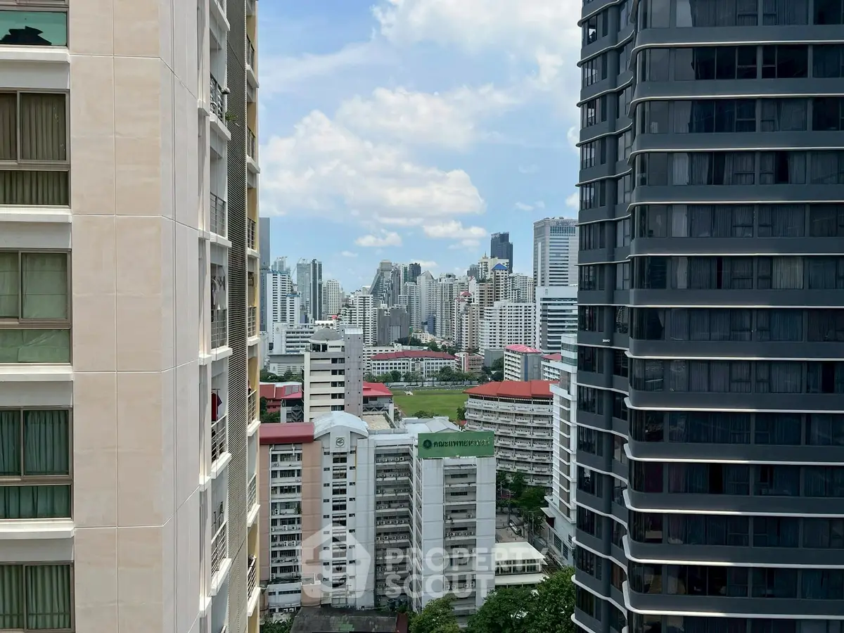 Stunning cityscape view from high-rise building, showcasing urban skyline and modern architecture.