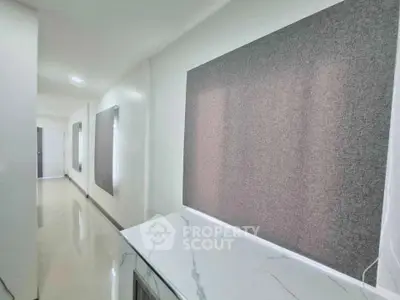 Modern hallway with sleek marble countertop and minimalist design