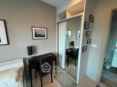 Modern bedroom with stylish decor and mirrored closet doors