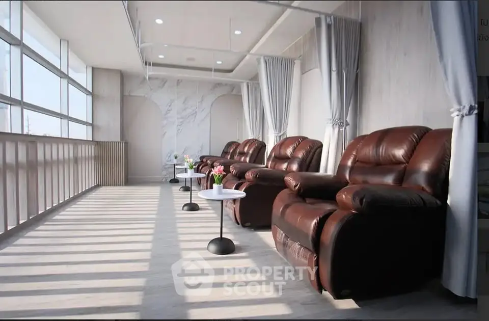 Luxurious lounge area with plush leather recliners and panoramic windows