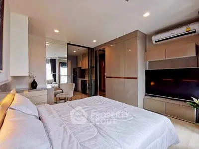 Modern bedroom with sleek design, featuring built-in storage and air conditioning.
