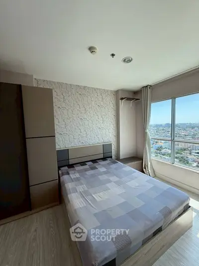 Modern bedroom with city view and stylish decor