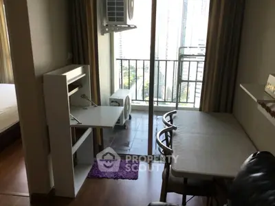 Modern apartment with balcony view and compact study area
