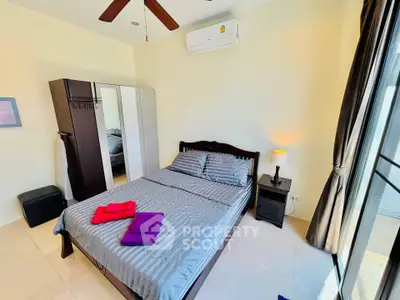 Bright and cozy bedroom with modern furnishings and ample natural light.