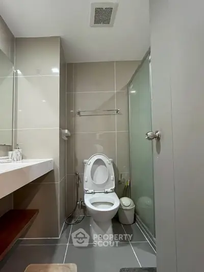 Modern bathroom with sleek design and glass shower enclosure