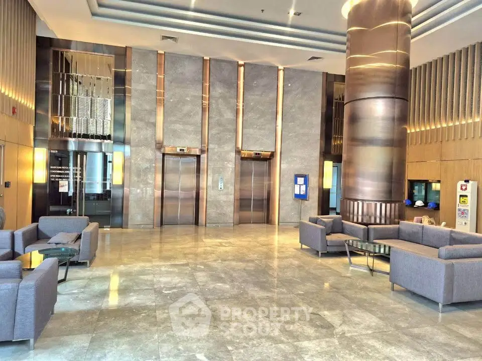 Luxurious modern lobby with sleek elevators and stylish seating area