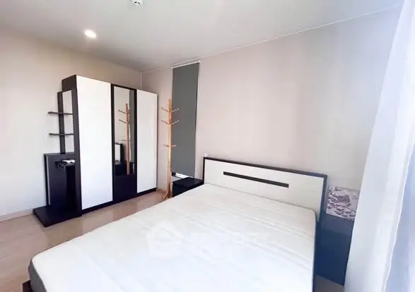 Modern bedroom with sleek furniture and natural light