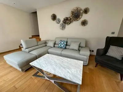 Stylish living room with modern furniture and elegant wall decor