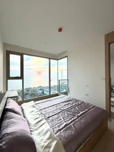 Luxurious bedroom with stunning ocean view and modern decor