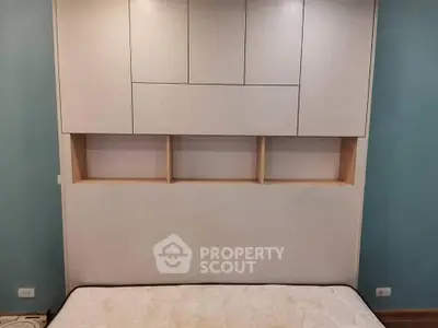 Modern bedroom with built-in storage and stylish headboard design