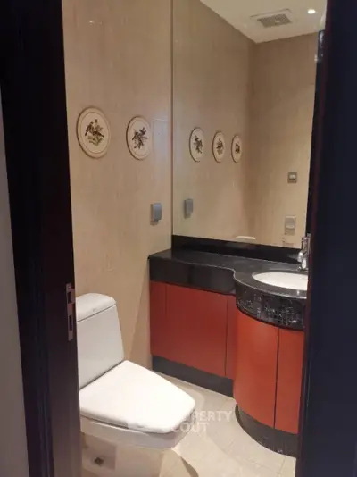 Modern bathroom with elegant fixtures and decorative wall plates