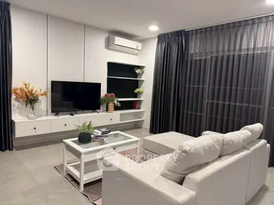 Modern living room with sleek furniture and stylish decor