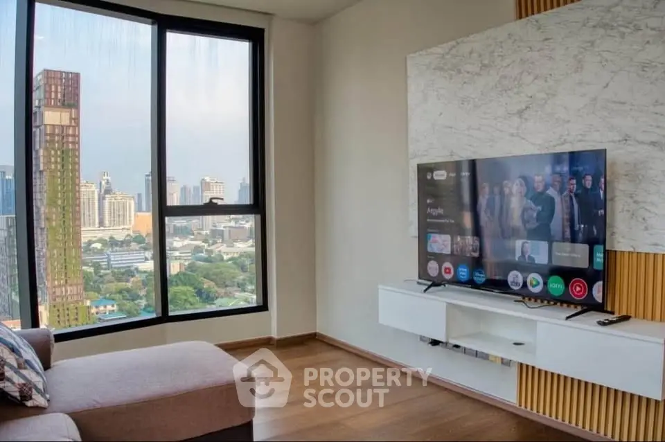 Modern living room with city view and stylish TV setup