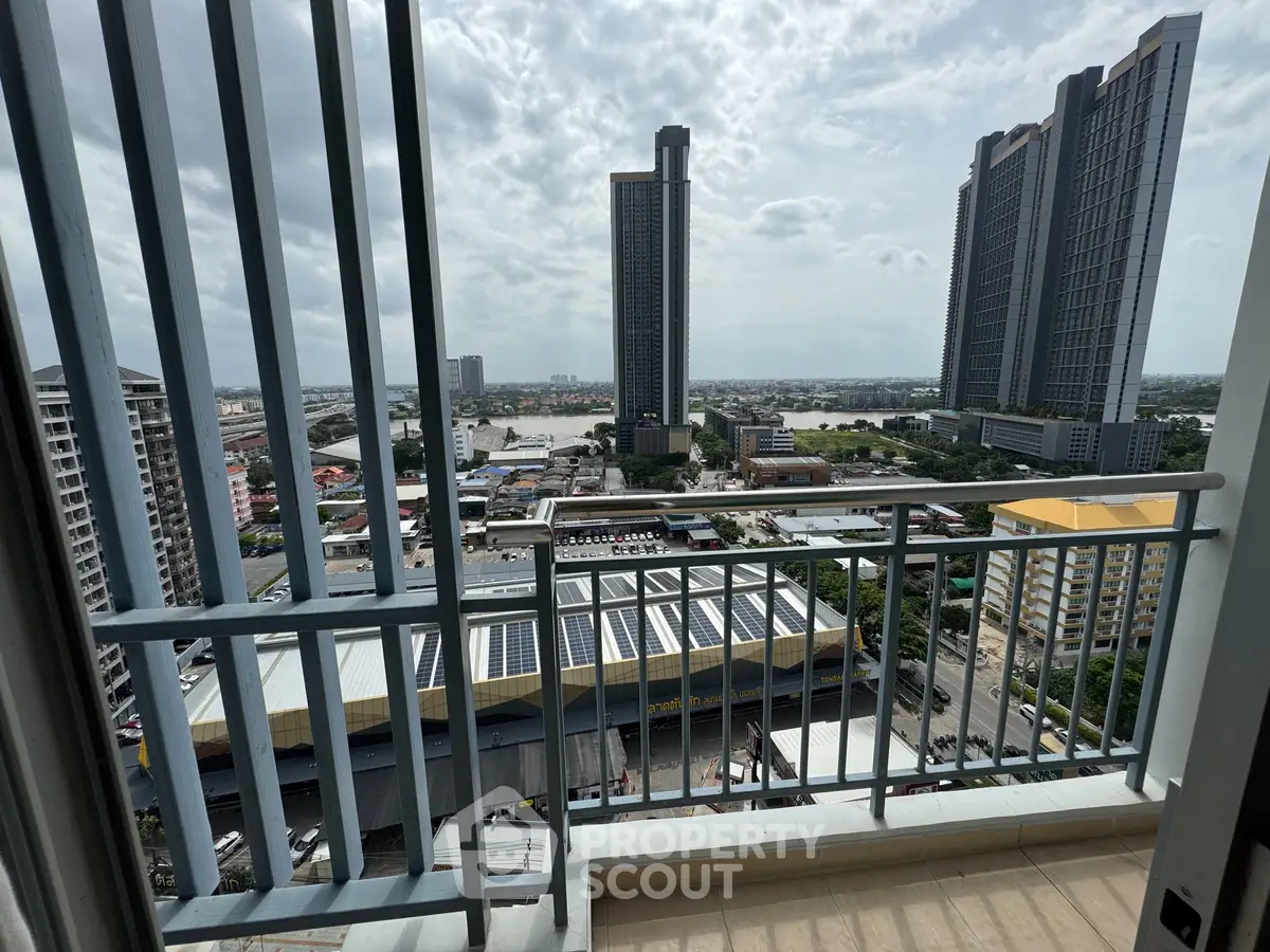 Stunning cityscape view from a high-rise balcony with modern skyscrapers.