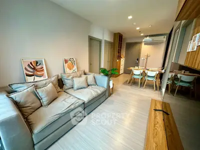 Modern living room with stylish decor and open dining area