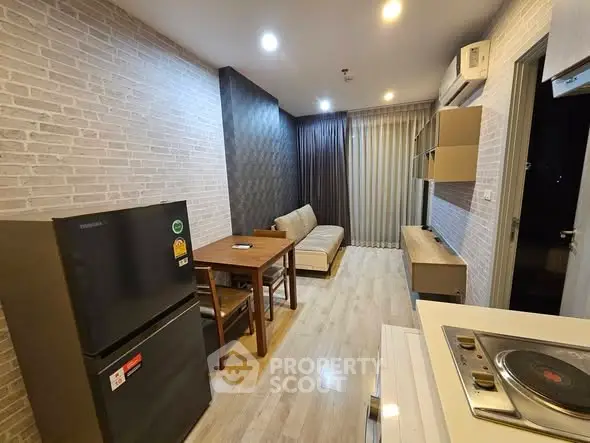 Modern living room with open kitchen layout and stylish decor