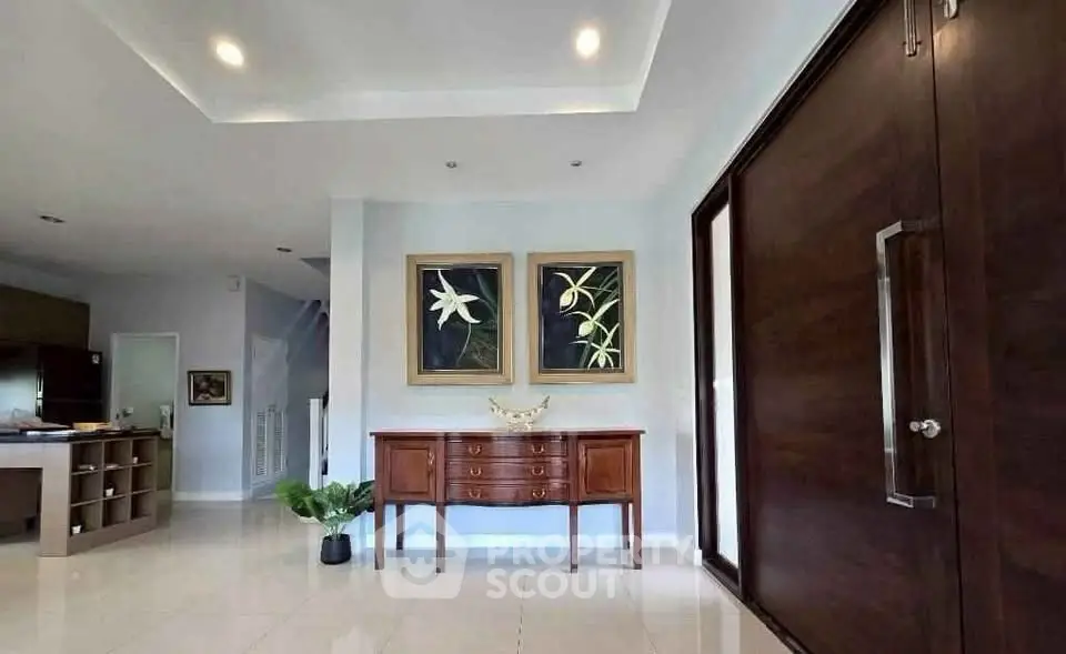 Elegant entryway with modern decor and wooden accents