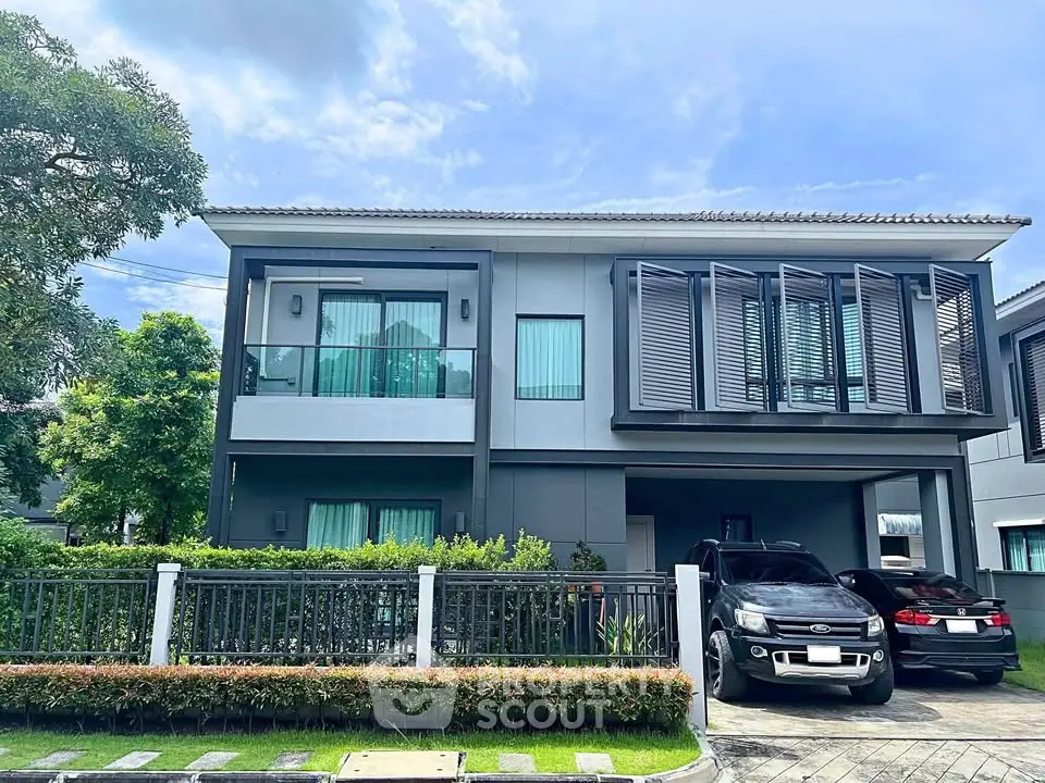 Modern two-story house with sleek design and spacious driveway