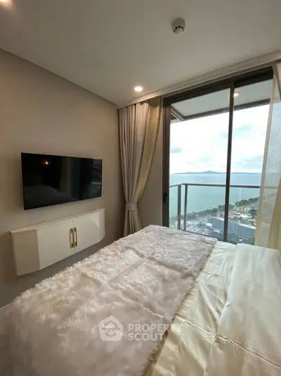 Luxurious bedroom with stunning ocean view and modern decor