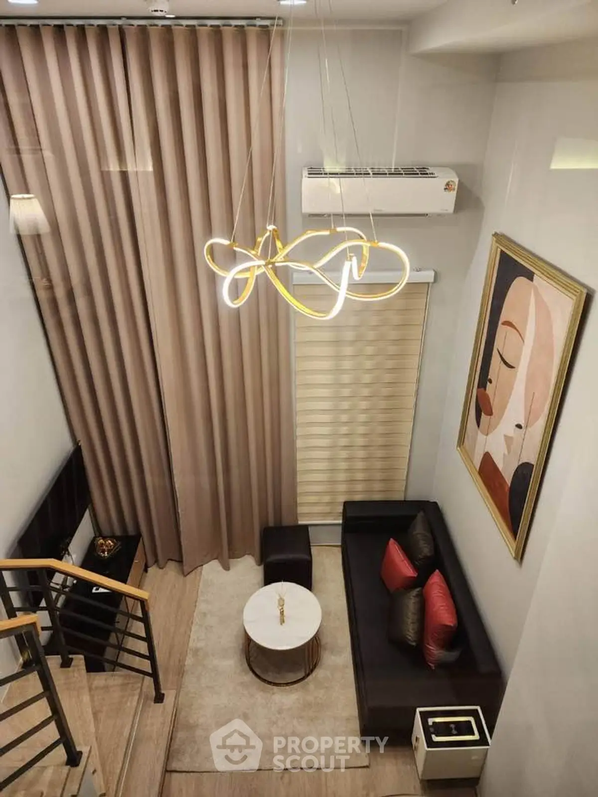 Luxurious modern living room with high ceiling, elegant chandelier, and stylish decor in a contemporary apartment.