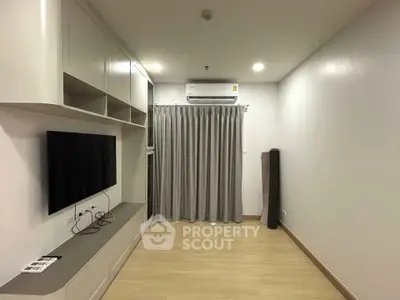 Modern living room with sleek built-in storage and air conditioning