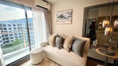 Stylish living room with balcony view in modern apartment