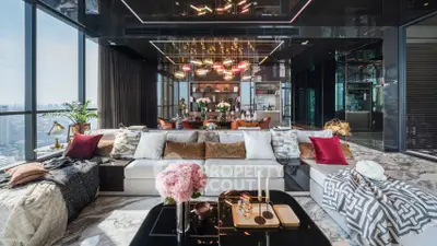 Luxurious modern living room with panoramic city views and elegant decor