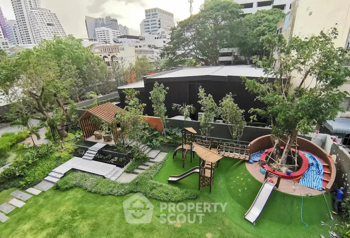Spacious urban garden with modern playground and lush greenery