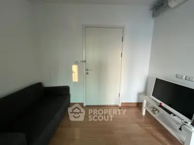 Cozy living room with minimalist decor and sleek TV setup