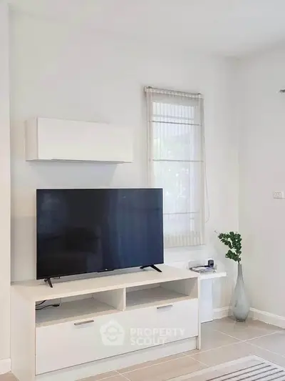Modern living room with sleek TV stand and minimalist decor