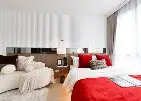 Luxurious modern bedroom with stylish decor and natural light