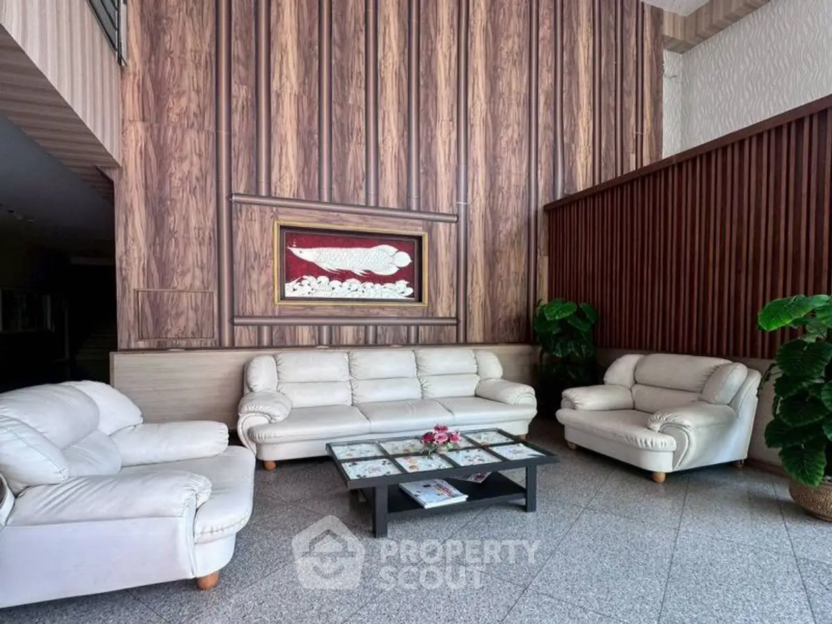 Elegant lobby with plush white sofas and modern wood paneling