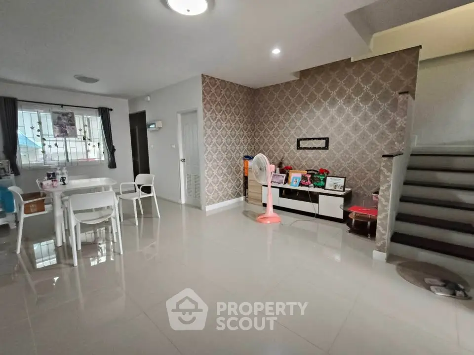 Spacious modern living room with elegant decor and dining area
