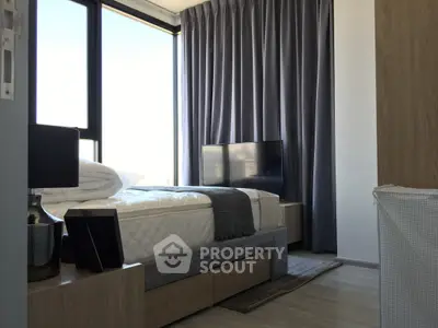 Modern bedroom with large window and stylish decor