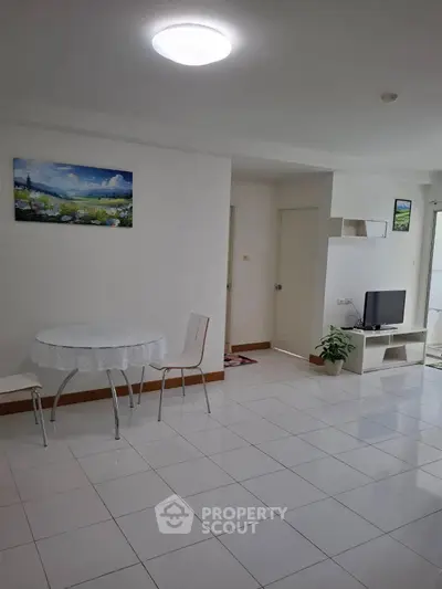 Bright living room with modern decor and tiled flooring