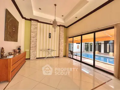 Spacious living room with pool view and elegant decor