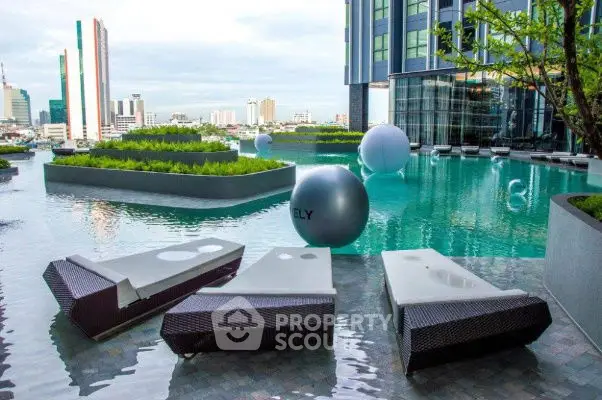 Luxurious rooftop pool with modern loungers and stunning cityscape view.