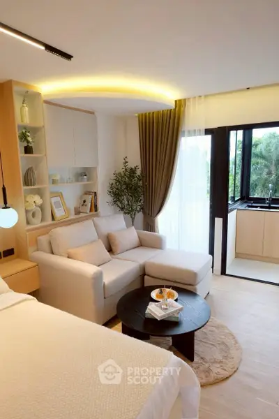 Modern studio apartment with cozy living area and open kitchen design