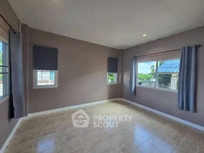 Spacious corner unit with large windows and natural light, perfect for a cozy living room setup.