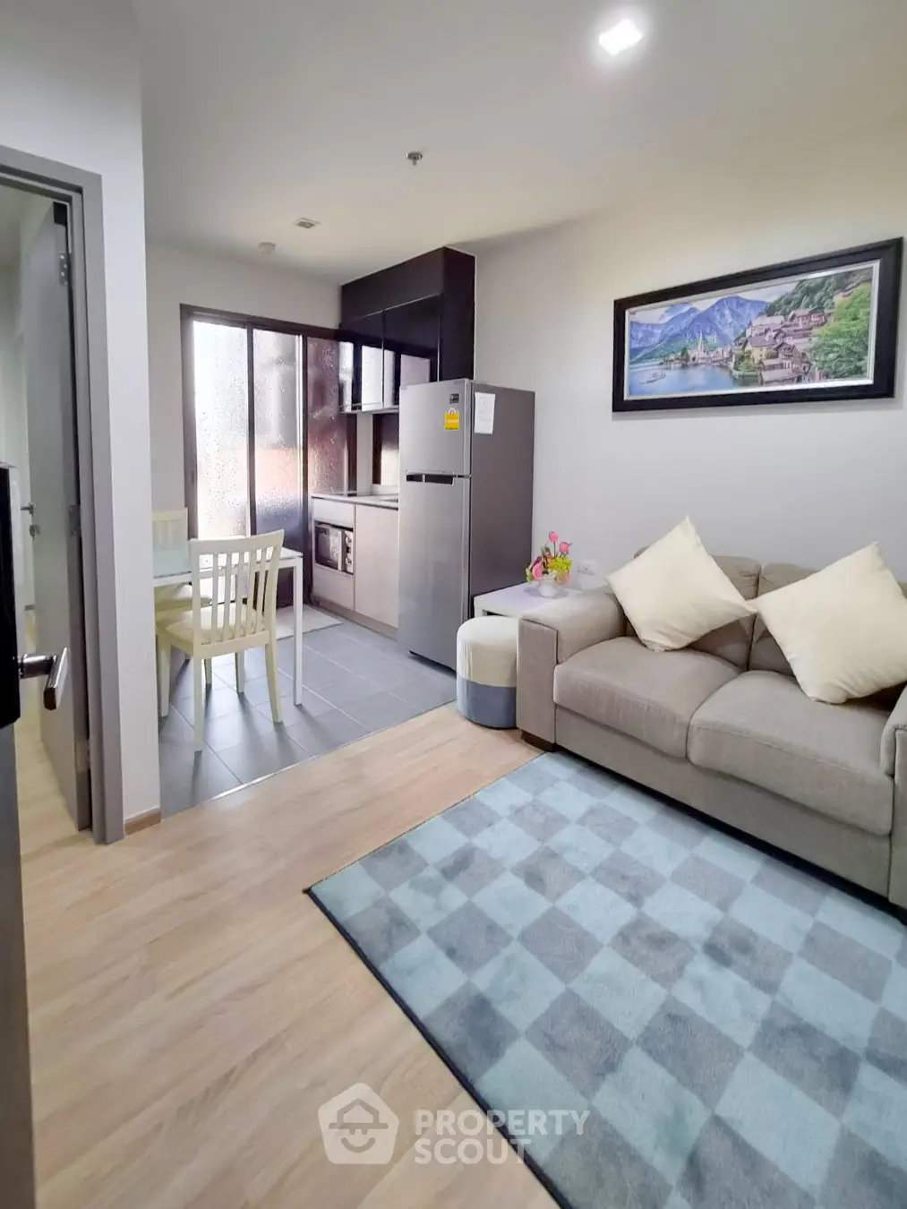Cozy living room with modern kitchen in open layout apartment