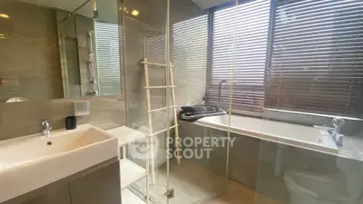 Modern bathroom with sleek design and large window blinds