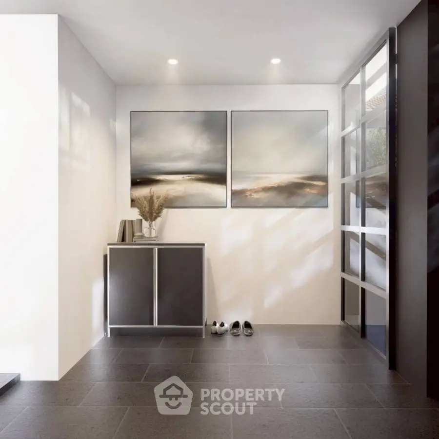 Modern entrance with sleek decor and natural light