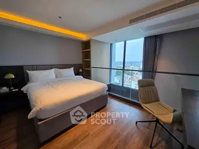 Luxurious bedroom with stunning city view and modern furnishings