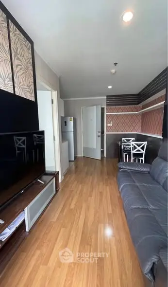 Modern living room with wooden flooring and stylish decor