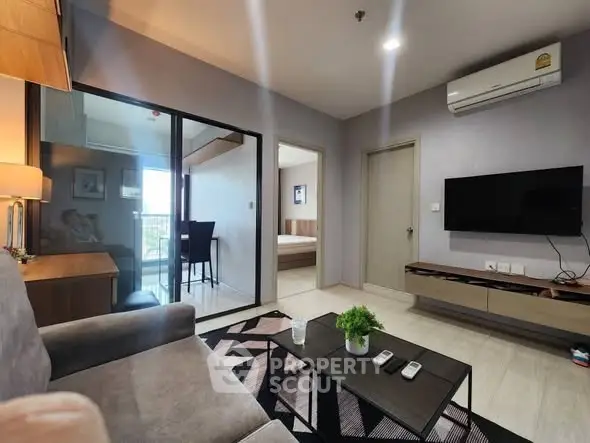 Modern living room with sleek furniture and balcony view