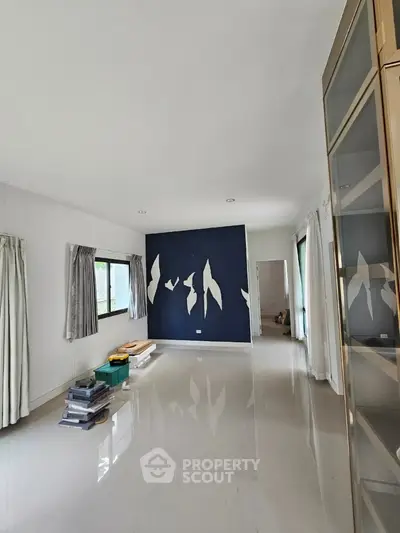 Spacious living room with modern design and large windows
