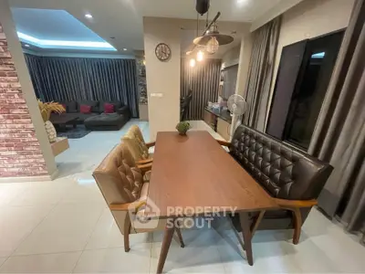 Stylish modern living room with elegant dining area and cozy seating, perfect for entertaining guests.